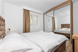 Postel nebo postele na pokoji v ubytování Apartments Dončić
