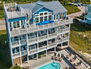 an aerial view of a house with a swimming pool at Blue Haven | Oceanfront| Pool | Hot Tub | North Topsail Beach | Luxury Vacation Rental in North Topsail Beach