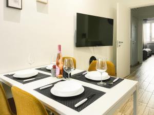 TV a/nebo společenská místnost v ubytování Inalpi Arena Modern Suite