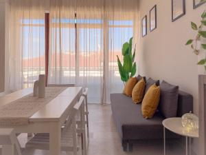 a living room with a couch and a table at Vittorio Veneto - Spacious and Bright by Host Hero in Civitanova Marche