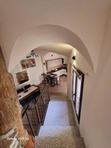 a view from the stairs of a house with an archway at Biginau ' e giosso in Ilbono