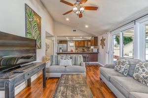 a living room with a couch and a fireplace at F-66 Poolside Retreat in Anaheim