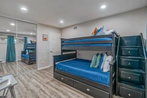 a bedroom with bunk beds and a mirror at F-65 Adventure House in Anaheim +20 photos