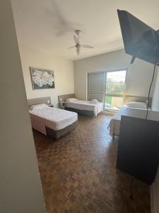 Ένα ή περισσότερα κρεβάτια σε δωμάτιο στο Hostel Senhor do Café