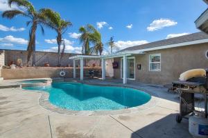 a swimming pool in the backyard of a home at F-58 Mandos Hideaway in Anaheim