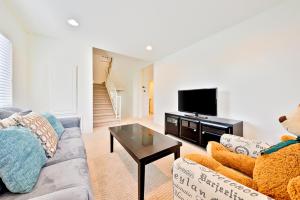 a living room with a couch and a tv at F-56 Winnie the Poohs Treehouse in Anaheim