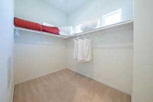 a white room with a shelf with towels on it at F-56 Winnie the Poohs Treehouse in Anaheim +22 photos