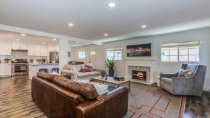 a living room with two couches and a fireplace at F-53 Trenton in Anaheim