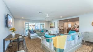 a living room with blue and white furniture at F-53 Trenton in Anaheim