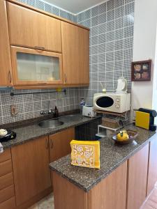 Η κουζίνα ή μικρή κουζίνα στο Grandpa's Nook - Torralta- Vista Mar