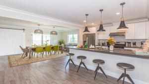 a kitchen and living room with a table and chairs at F-52 Trenton II in Anaheim