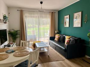 a living room with a couch and a table at Casa Hoyo 19 in Masía Aldamar