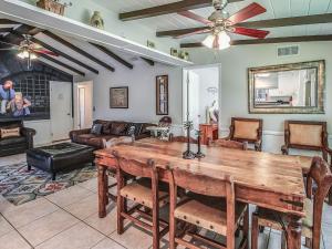 a living room with a wooden table and a couch at F-29 The Pirates Cove in Anaheim