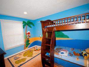 a childs bedroom with a bunk bed with blue walls at F-29 The Pirates Cove in Anaheim +17 photos