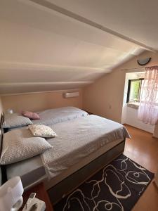 Postel nebo postele na pokoji v ubytování Apartman Luka