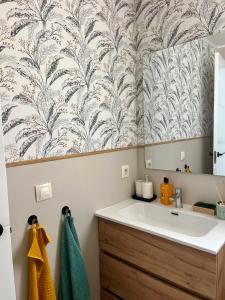 a bathroom with a sink and a mirror at Casa Hoyo 19 in Masía Aldamar