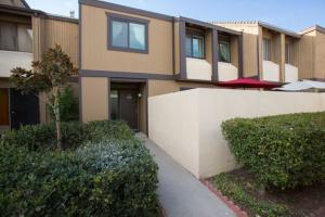 a house with a sidewalk in front of it at Under the Sea by Funtierland Vacation Rentals in Anaheim
