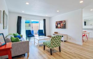a living room with a couch and a table at New Suite Escapes 6 by Funtierland Vacation Rentals in Anaheim