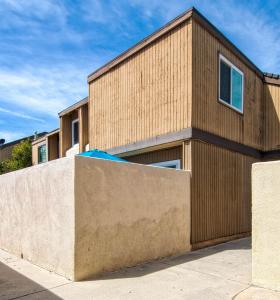 a wooden house with a concrete wall at New Suite Escapes 6 by Funtierland Vacation Rentals in Anaheim
