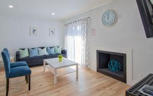 a living room with a couch and a fireplace at New Suite Escapes 5 by Funtierland Vacation Rentals in Anaheim