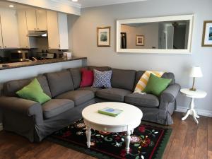 a living room with a couch and a table at Arendelle by Funtierland Vacation Rentals in Anaheim
