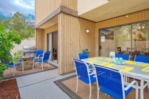 a blue table and chairs on a patio at Tron by Funtierland Vacation Rentals in Anaheim