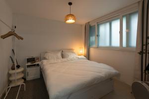 Ένα ή περισσότερα κρεβάτια σε δωμάτιο στο Forest Hangang