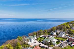 an aerial view of a small town by the water at Ferienwohnung mit traumhaftem Meerblick - Haus am Meer FeWo 12 in Lohme