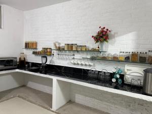 a kitchen with a counter with a counter top with a counter sidx sidx at Sir Mam Ashram in Bhaddi