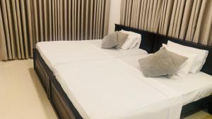 Postel nebo postele na pokoji v ubytování Hawana Home Stay