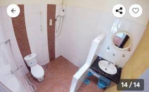 a bathroom with a toilet and a sink and a mirror at The Endless Bangtao Residence TV2 AND TV 3 in Bang Tao Beach +21 photos