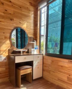 a bathroom with a sink and a mirror at Viena Homestay in Bắc Hà