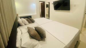 Postel nebo postele na pokoji v ubytování Hawana Home Stay