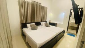 Postel nebo postele na pokoji v ubytování Hawana Home Stay