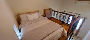 a small bedroom with a bed and a dresser at The Nook in Maleme