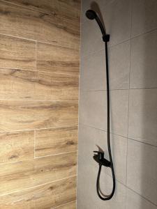 a shower with a shower head in a bathroom at Casa vacacional Ajo in Ajo +49 photos