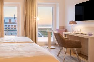 Voodi või voodid majutusasutuse Hotel Stranddistel toas
