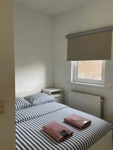 Rúm í herbergi á Private studio in Antwerp