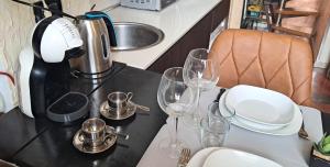 a table with wine glasses on top of it at Urban Loft 56 Moscova- Metro 2 min - TheModelsApartment in Milan