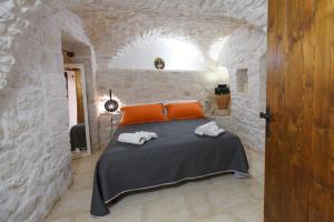 A bed or beds in a room at Trullo Gio