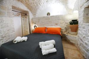 A bed or beds in a room at Trullo Gio Még 37 kép