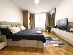 TV a/nebo společenská místnost v ubytování Maribelle Apartments