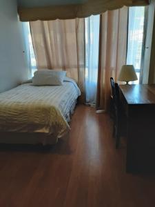 Postel nebo postele na pokoji v ubytování Anexo Hotel Quitor