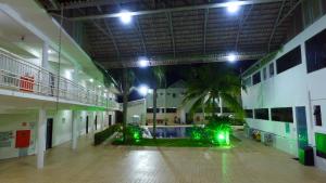 a large building with lights in the middle of it at Valentim Palace Hotel in Valentim Gentil