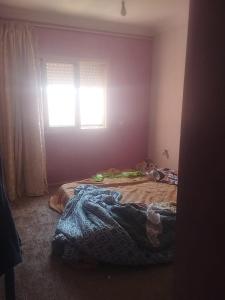 a bedroom with two beds and a window at Apartment Dar Salam in Marrakesh