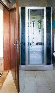 a glass door to a shower in a kitchen at Biyem Hotel in Kampala