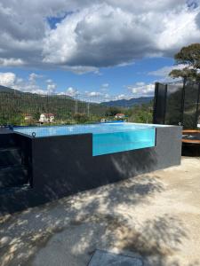 a swimming pool with a view of a mountain at As Leirinhas in Touvedo