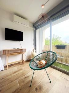 Μια τηλεόραση ή/και κέντρο ψυχαγωγίας στο Le COSY BALI Studio lumineux