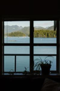a view of a lake from a window at Island Vista - Waterfront Condo in Tofino