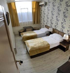 Ένα ή περισσότερα κρεβάτια σε δωμάτιο στο Estet Hotel